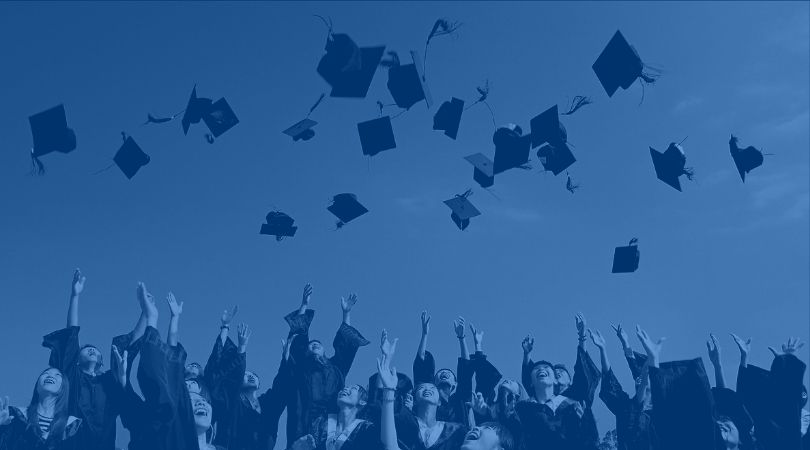 Students throwing graduation caps